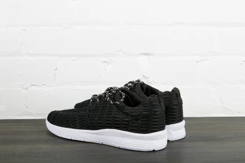Black sneakers with white sole