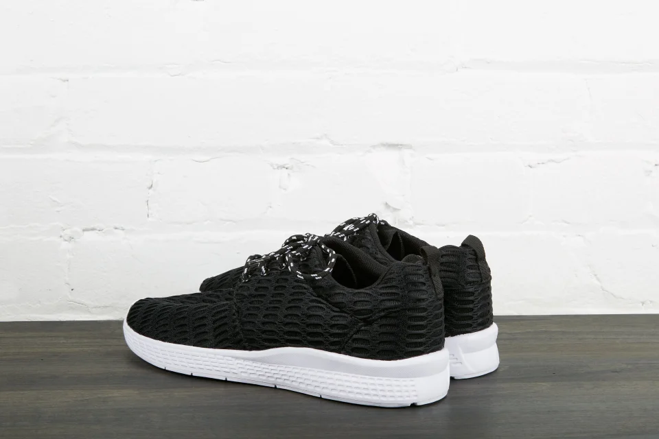 Black sneakers with white sole